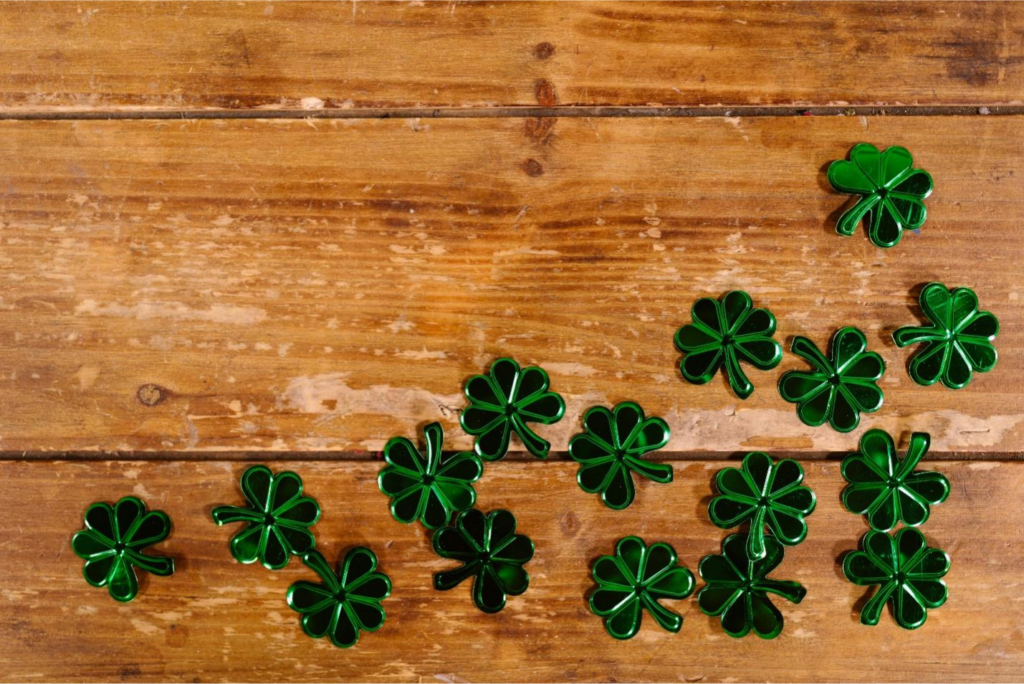 Shamrock props on a wooden surface